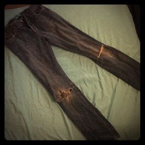 Used skinny jeans with holes in knees